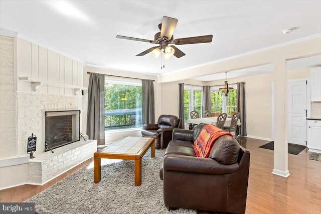 1905 Artillery Ridge Rd, Fredericksburg, VA 22408 - living area with wood finished floors, ceiling fan, healthy amount of natural light, baseboards, and crown molding