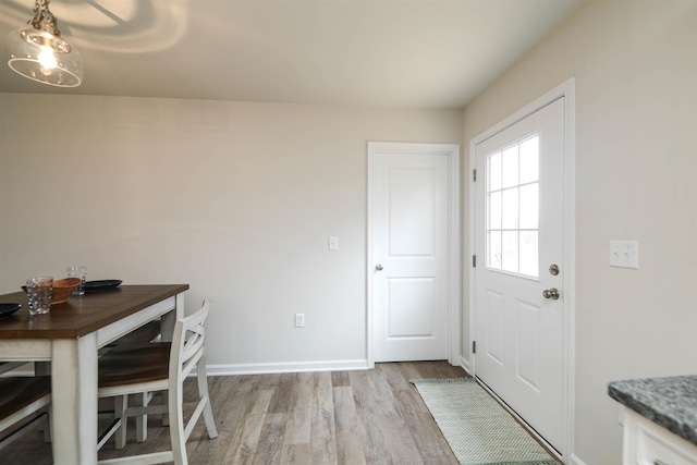 unfurnished dining area with light hardwood / wood-style flooring