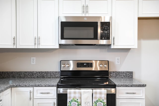 kitchen with white cabinetry and appliances with stainless steel finishes