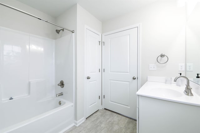 bathroom with shower / tub combination and vanity