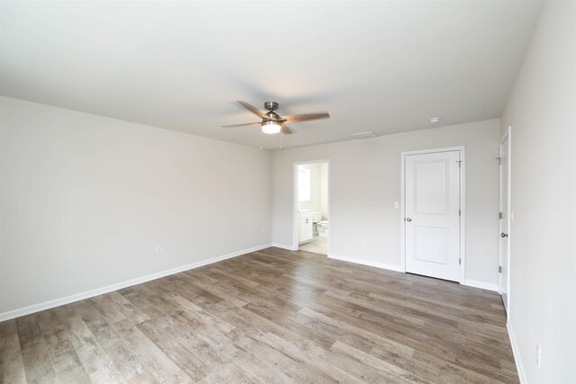 spare room featuring ceiling fan and light wood-type flooring