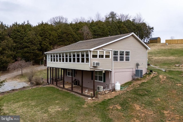 145 Colwood Dr, Rileyville, VA 22650 - rear view of property featuring a yard, a wooded view, ac unit, a patio area, and central air condition unit