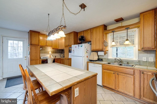 145 Colwood Dr, Rileyville, VA 22650 - kitchen with tile countertops, plenty of natural light, white appliances, a sink, and backsplash