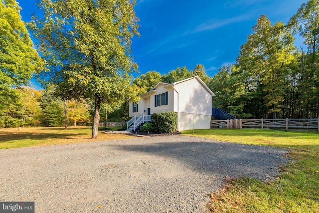  - view of side of property featuring driveway