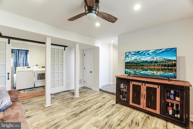  - living room featuring washing machine and dryer, a barn door, wood finished floors, ceiling fan, and recessed lighting