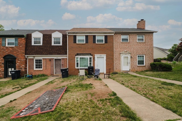 1333 Devon Ln, Harrisonburg, VA 22801 - view of property with a chimney, a front yard, brick siding, and a shingled roof
