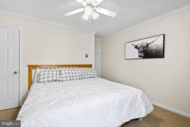 bedroom featuring a ceiling fan, carpet flooring, crown molding, and baseboards