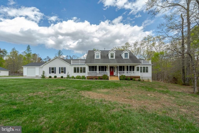 - new england style home featuring a porch, a garage, and a front lawn
