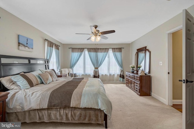  - bedroom with multiple windows, baseboards, carpet flooring, and ceiling fan
