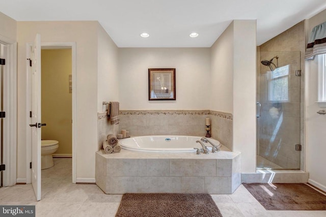  - full bathroom with a shower stall, a garden tub, tile patterned flooring, and toilet