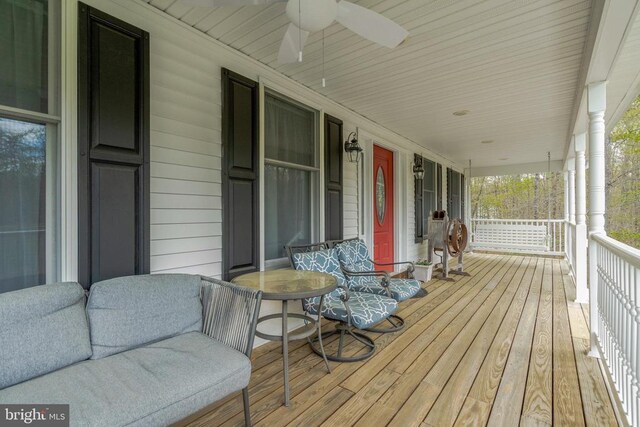  - wooden terrace with a porch and ceiling fan