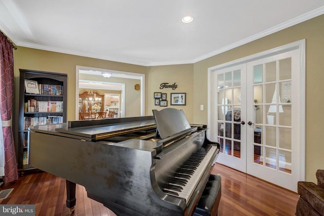  - sitting room with french doors, dark wood-style floors, ornamental molding, and recessed lighting