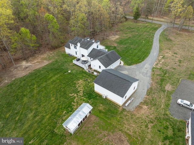  - aerial view of property and surrounding area featuring a heavily wooded area