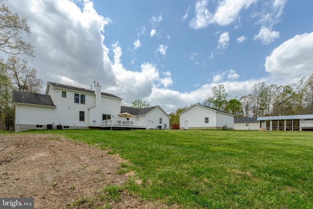  - view of green lawn featuring a wooden deck