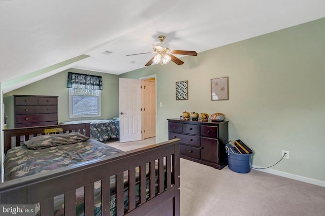  - carpeted bedroom with lofted ceiling, baseboards, and ceiling fan