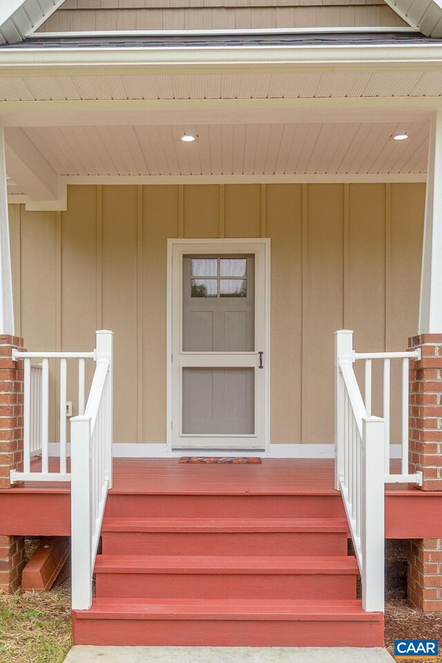 6169 Community House Rd, Columbia, VA 23038 - doorway to property featuring board and batten siding