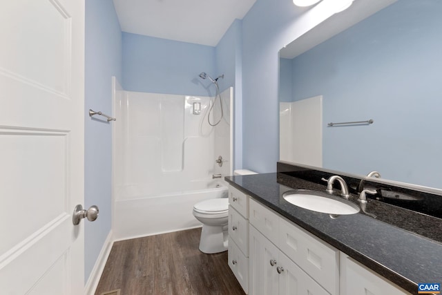 6169 Community House Rd, Columbia, VA 23038 - bathroom with toilet, wood finished floors, vanity, and  shower combination
