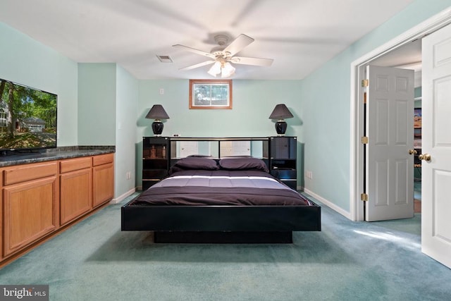  - bedroom featuring carpet flooring, multiple windows, baseboards, and ceiling fan