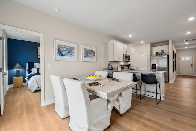 14767 Green View Dr, Elkton, VA 22827 - dining space with light wood-type flooring, visible vents, and baseboards