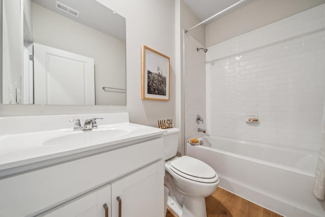 14767 Green View Dr, Elkton, VA 22827 - bathroom featuring toilet, wood finished floors, bathtub / shower combination, visible vents, and vanity
