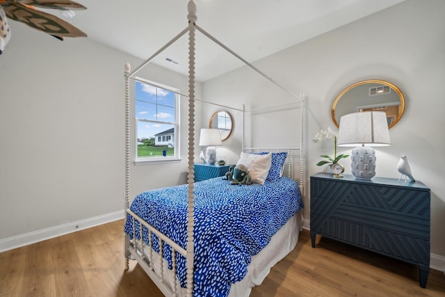 14767 Green View Dr, Elkton, VA 22827 - bedroom featuring visible vents, wood finished floors, and baseboards