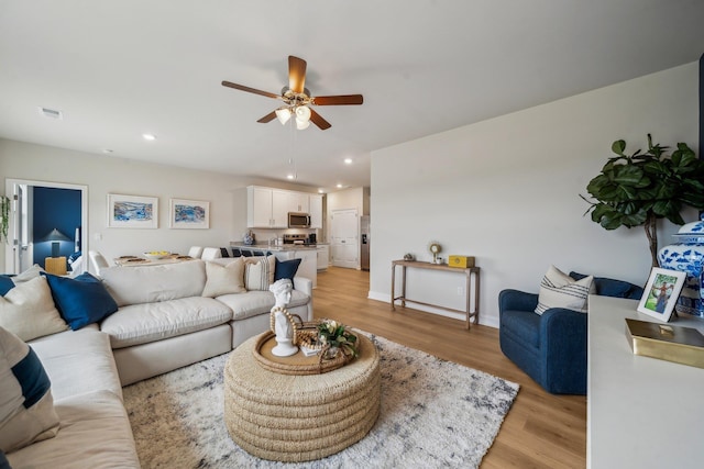 14767 Green View Dr, Elkton, VA 22827 - living area with light wood-type flooring, a ceiling fan, visible vents, and recessed lighting