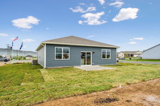 14767 Green View Dr, Elkton, VA 22827 - rear view of house featuring central air condition unit, a patio, and a lawn