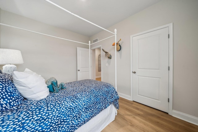 14767 Green View Dr, Elkton, VA 22827 - bedroom with baseboards, visible vents, and light wood-style floors