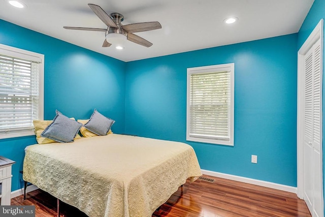  - bedroom with wood finished floors, a closet, recessed lighting, and ceiling fan