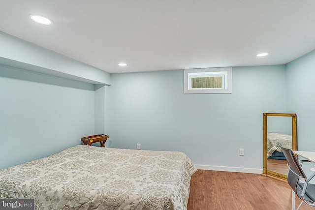  - bedroom featuring wood finished floors and recessed lighting