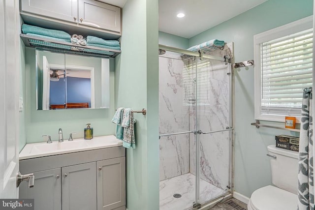  - bathroom featuring a marble finish shower, vanity, and recessed lighting