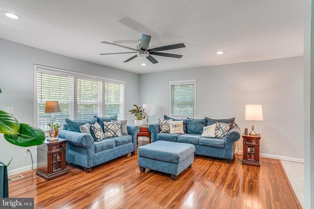  - living room with ceiling fan, wood finished floors, healthy amount of natural light, and recessed lighting