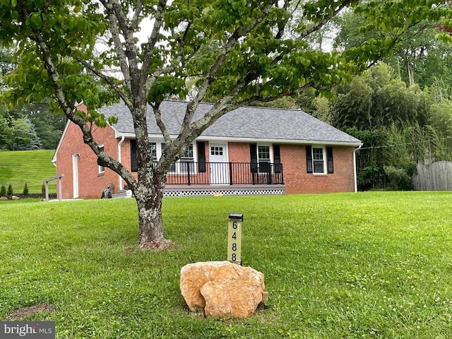  - ranch-style home with brick siding and a shingled roof