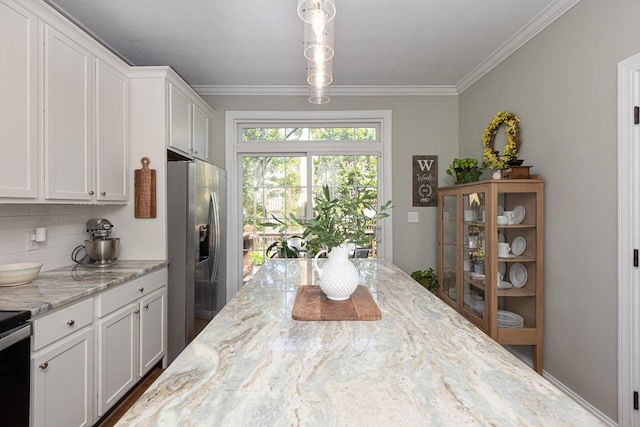 21 Spring View Dr, Staunton, VA 24401 - kitchen featuring stainless steel refrigerator with ice dispenser, crown molding, white cabinets, backsplash, and light stone counters