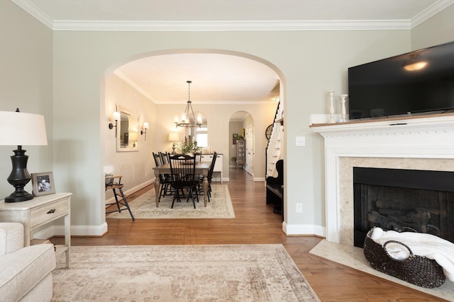 21 Spring View Dr, Staunton, VA 24401 - living room featuring arched walkways, ornamental molding, baseboards, wood finished floors, and a chandelier