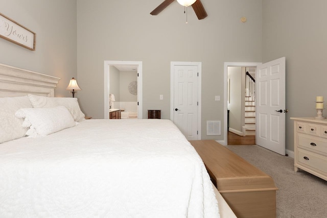 21 Spring View Dr, Staunton, VA 24401 - bedroom featuring a towering ceiling, light carpet, ensuite bath, baseboards, and ceiling fan