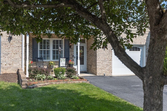 21 Spring View Dr, Staunton, VA 24401 - view of front of property with asphalt driveway, brick siding, an attached garage, and a front lawn