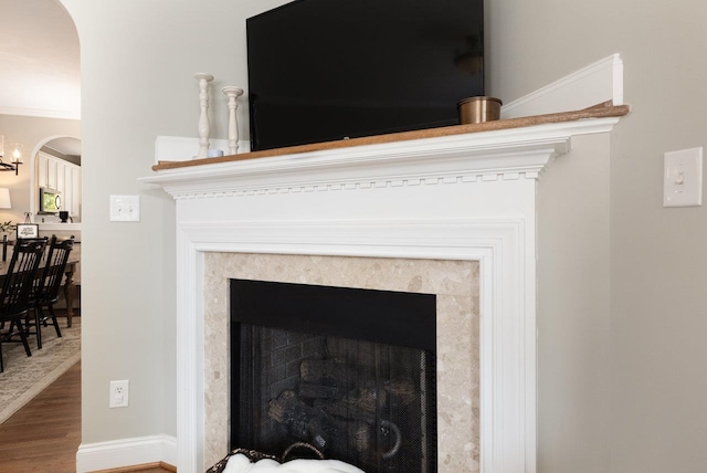 21 Spring View Dr, Staunton, VA 24401 - detailed view of arched walkways, wood finished floors, stainless steel microwave, a chandelier, and a fireplace