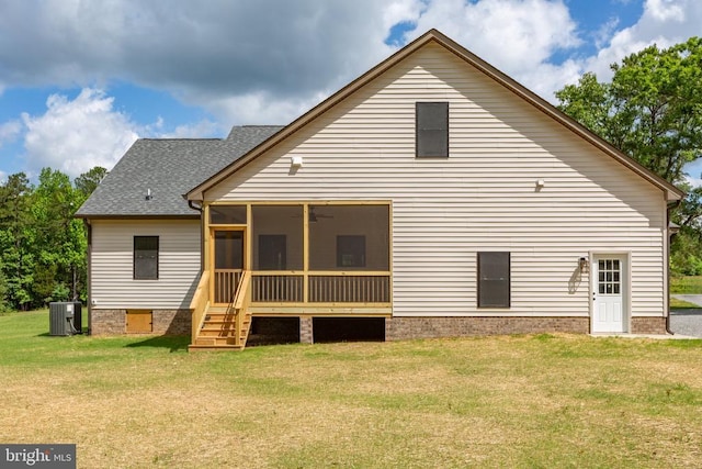 885 Buckners Ln, Compass Cove At Lake Anna Mineral, VA 23117 - rear view of property with central AC unit, a sunroom, a shingled roof, and a lawn