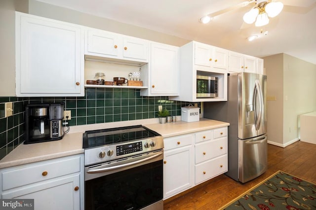 302 Gold Valley Rd, Locust Grove, VA 22508 - kitchen with appliances with stainless steel finishes, dark wood-style floors, white cabinetry, light countertops, and tasteful backsplash