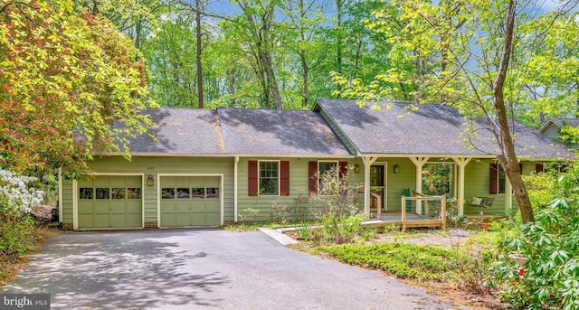 302 Gold Valley Rd, Locust Grove, VA 22508 - view of front of house with driveway, a garage, covered porch, and a shingled roof