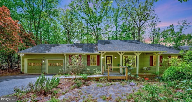 302 Gold Valley Rd, Locust Grove, VA 22508 - ranch-style home with driveway, a garage, covered porch, and a shingled roof