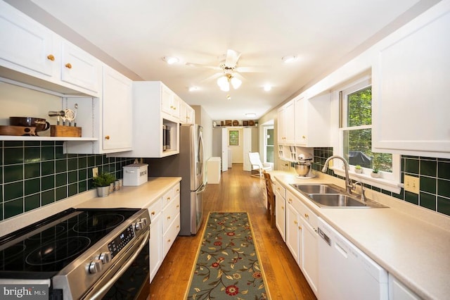 302 Gold Valley Rd, Locust Grove, VA 22508 - kitchen with appliances with stainless steel finishes, a sink, white cabinetry, and tasteful backsplash