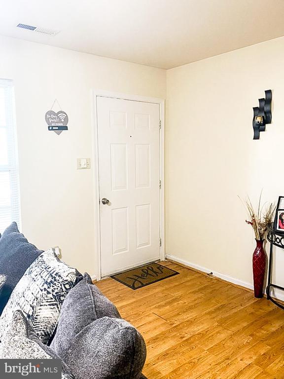 988 Towne Ln, Charlottesville, VA 22901 - living room featuring light wood-style floors and baseboards