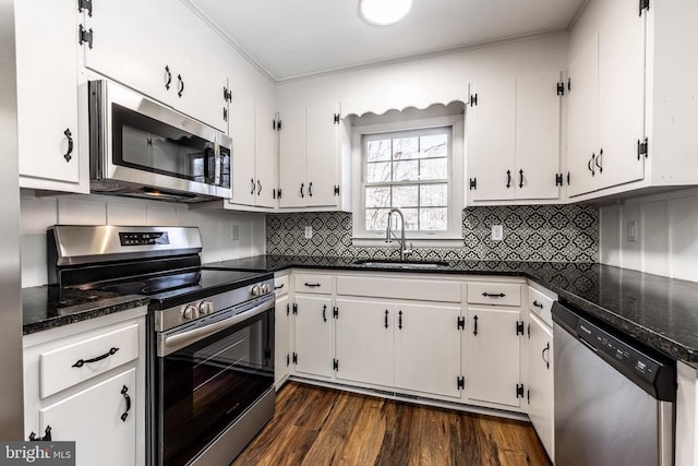 201 Chad Berry Ln, Syria, VA 22743 - kitchen with appliances with stainless steel finishes, a sink, white cabinets, and ornamental molding