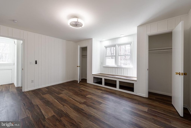 201 Chad Berry Ln, Syria, VA 22743 - unfurnished bedroom with dark wood-style floors, two closets, and baseboards