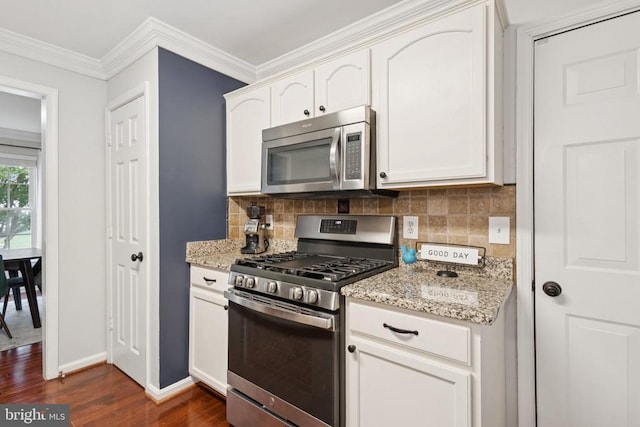 11729 Innisbrook Cir, Fredericksburg, VA 22407 - kitchen featuring appliances with stainless steel finishes, dark wood finished floors, backsplash, light stone counters, and ornamental molding