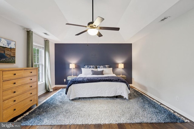 11729 Innisbrook Cir, Fredericksburg, VA 22407 - bedroom featuring wood finished floors, ceiling fan, and an accent wall