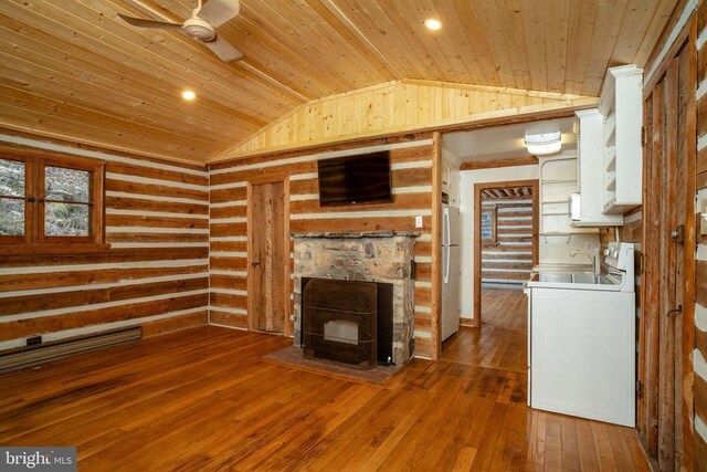 unfurnished living room featuring wood-type flooring, washer / dryer, vaulted ceiling, and wooden ceiling