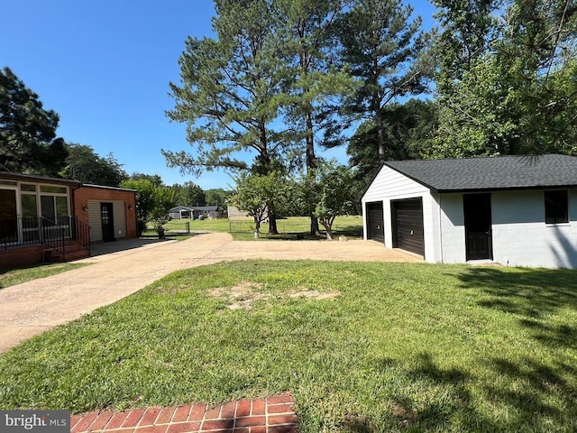 9872 Red Hill Rd, Spotsylvania, VA 22553 - view of green lawn with an outbuilding and a detached garage